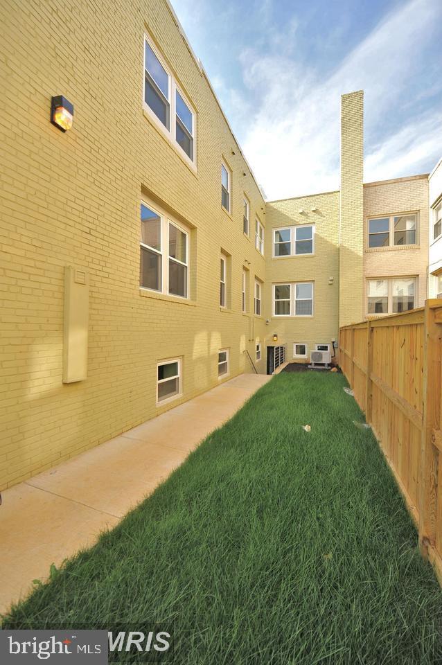 417 18th Street Northeast, Unit 103 Washington, DC 20002 - Photo 39 of 40 a view of an apartment with a backyard