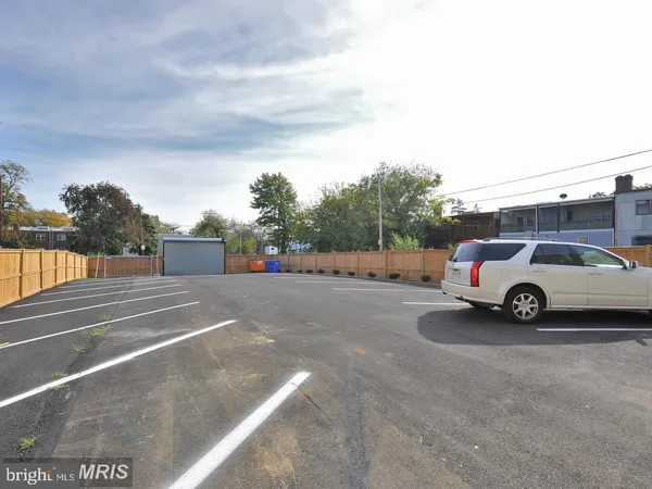 a view of street with parked cars