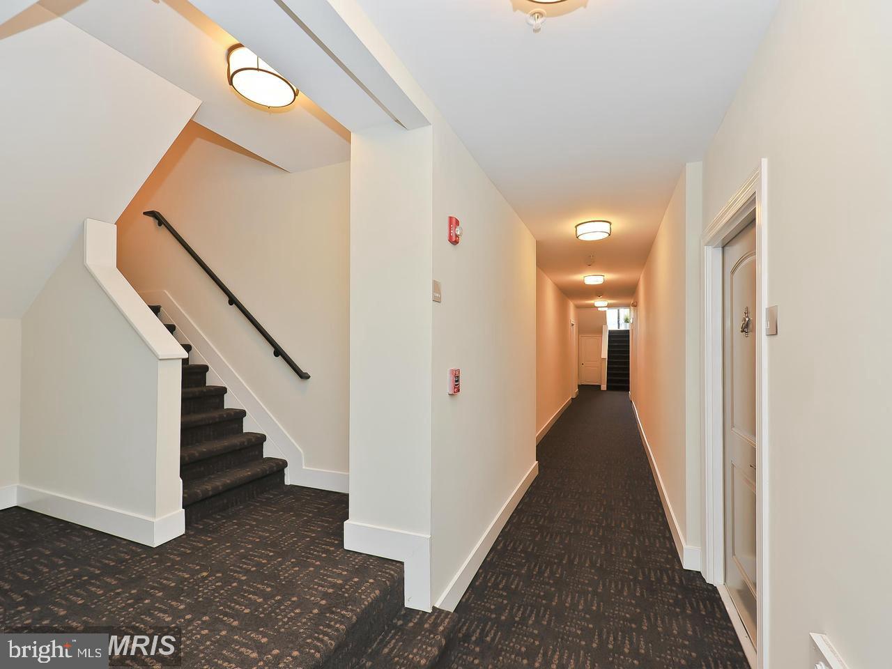 417 18th Street Northeast, Unit 103 Washington, DC 20002 - Photo 8 of 40 a view of a hallway with staircase