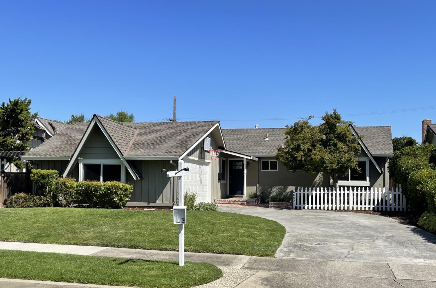 6863 Devon Way San Jose, CA 95129 - Photo 1 of 1 a front view of a house with a garden