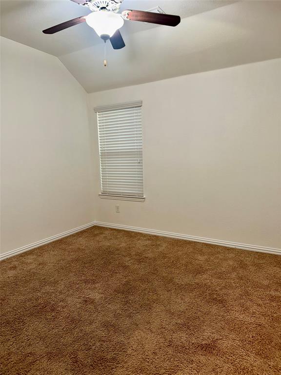 1308 Hudson Lane Prosper, TX 75078 - Photo 10 of 17 an empty room with a empty space and a ceiling fan