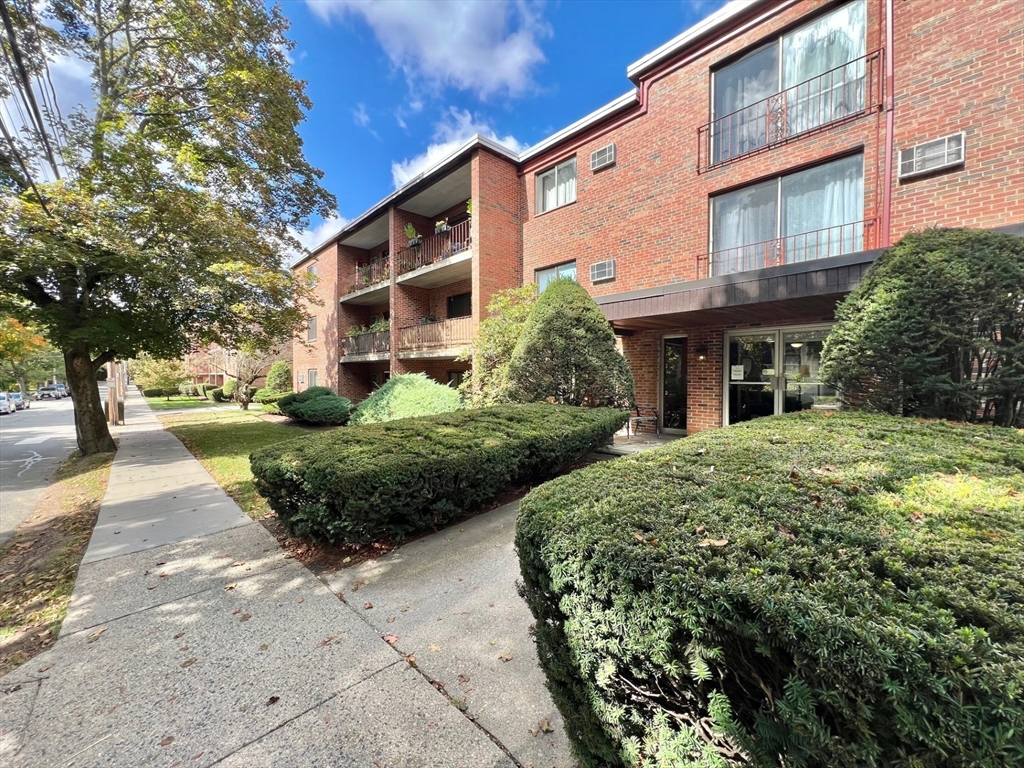 33 Paul Street, Unit 3314 Newton, MA 02459 - Photo 11 of 12 a view of a building with a garden