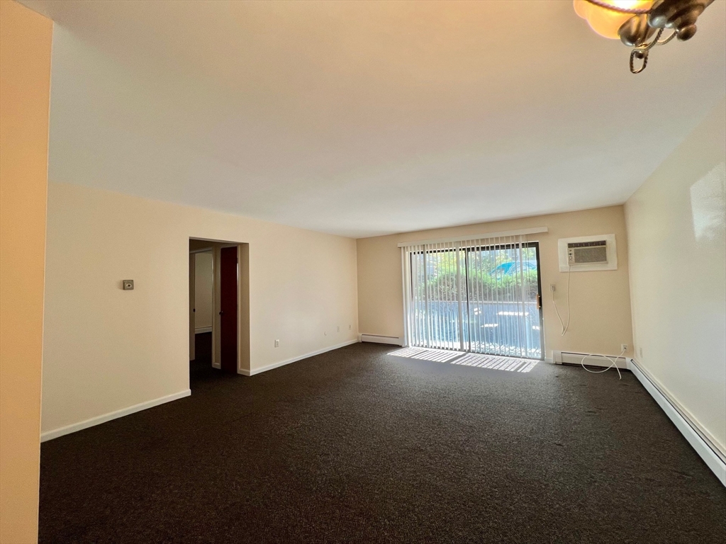 33 Paul Street, Unit 3314 Newton, MA 02459 - Photo 4 of 12 a view of an empty room with a window