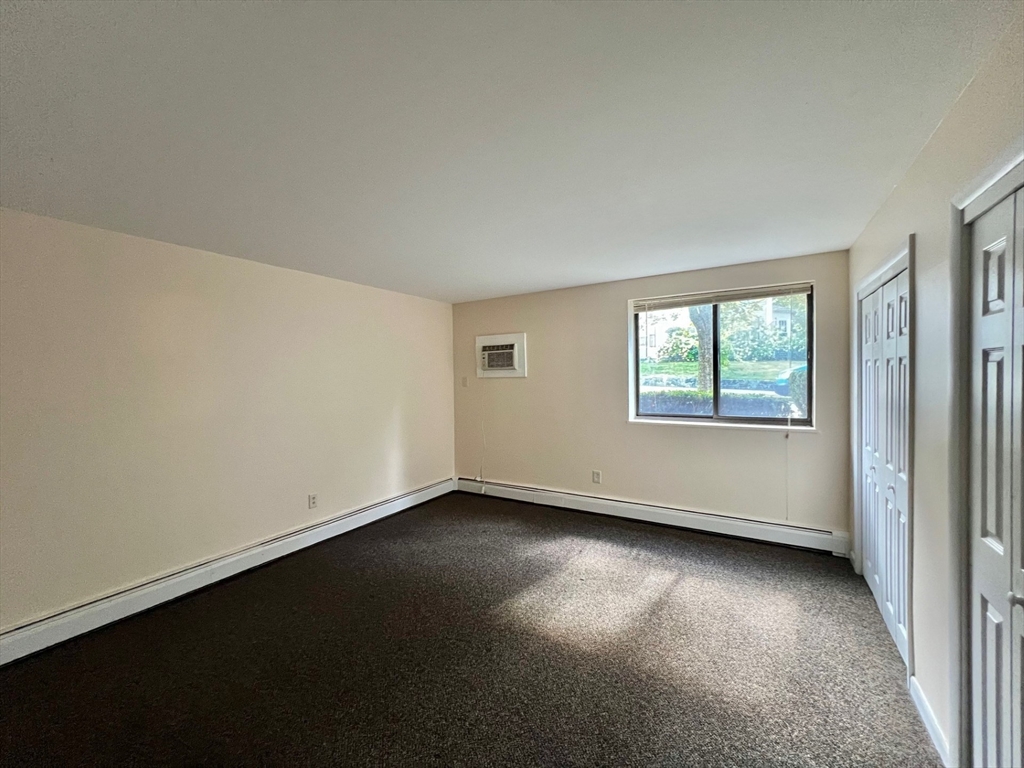 33 Paul Street, Unit 3314 Newton, MA 02459 - Photo 5 of 12 an empty room with a window