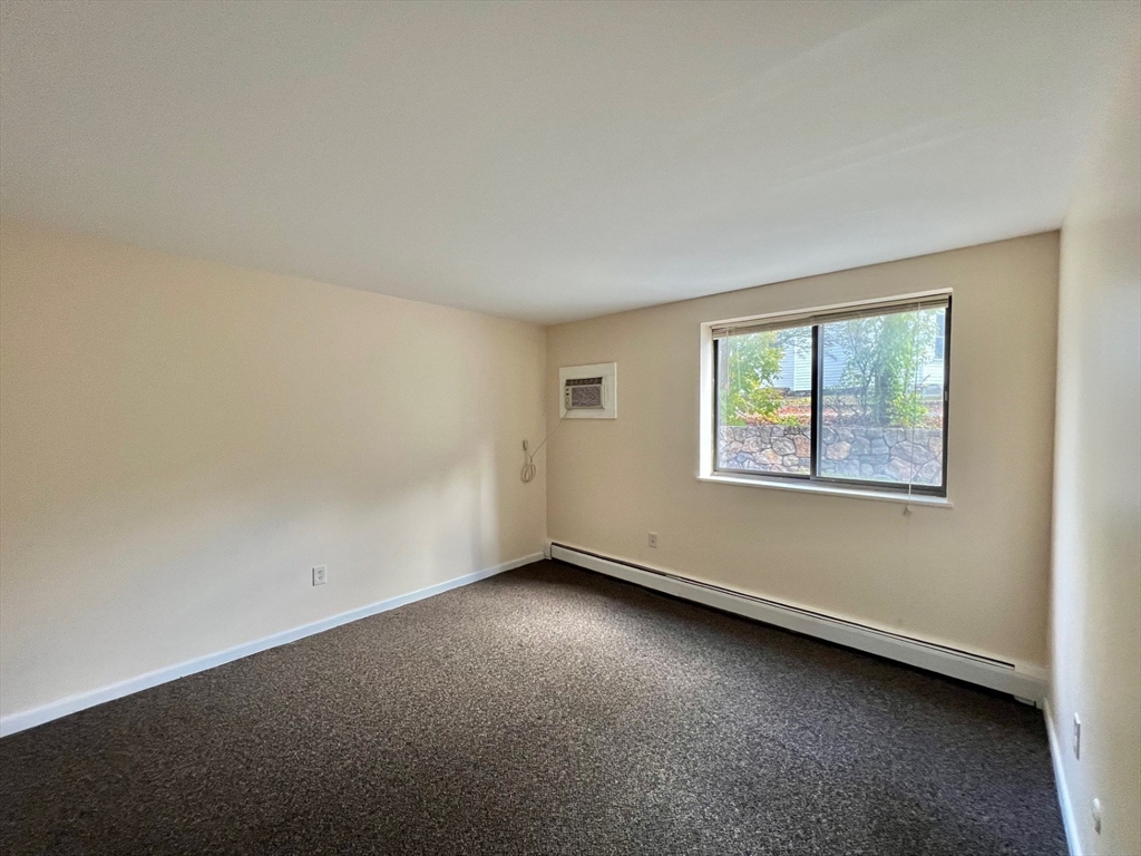 33 Paul Street, Unit 3314 Newton, MA 02459 - Photo 7 of 12 an empty room with a window