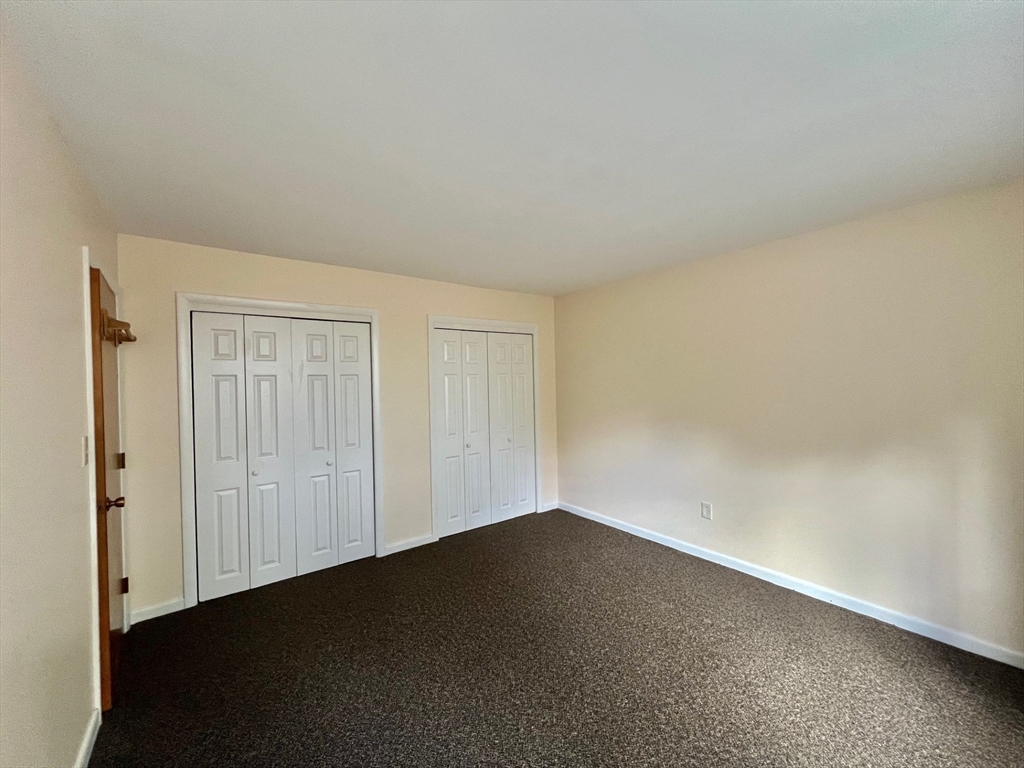 33 Paul Street, Unit 3314 Newton, MA 02459 - Photo 8 of 12 an empty room with a empty space and a window