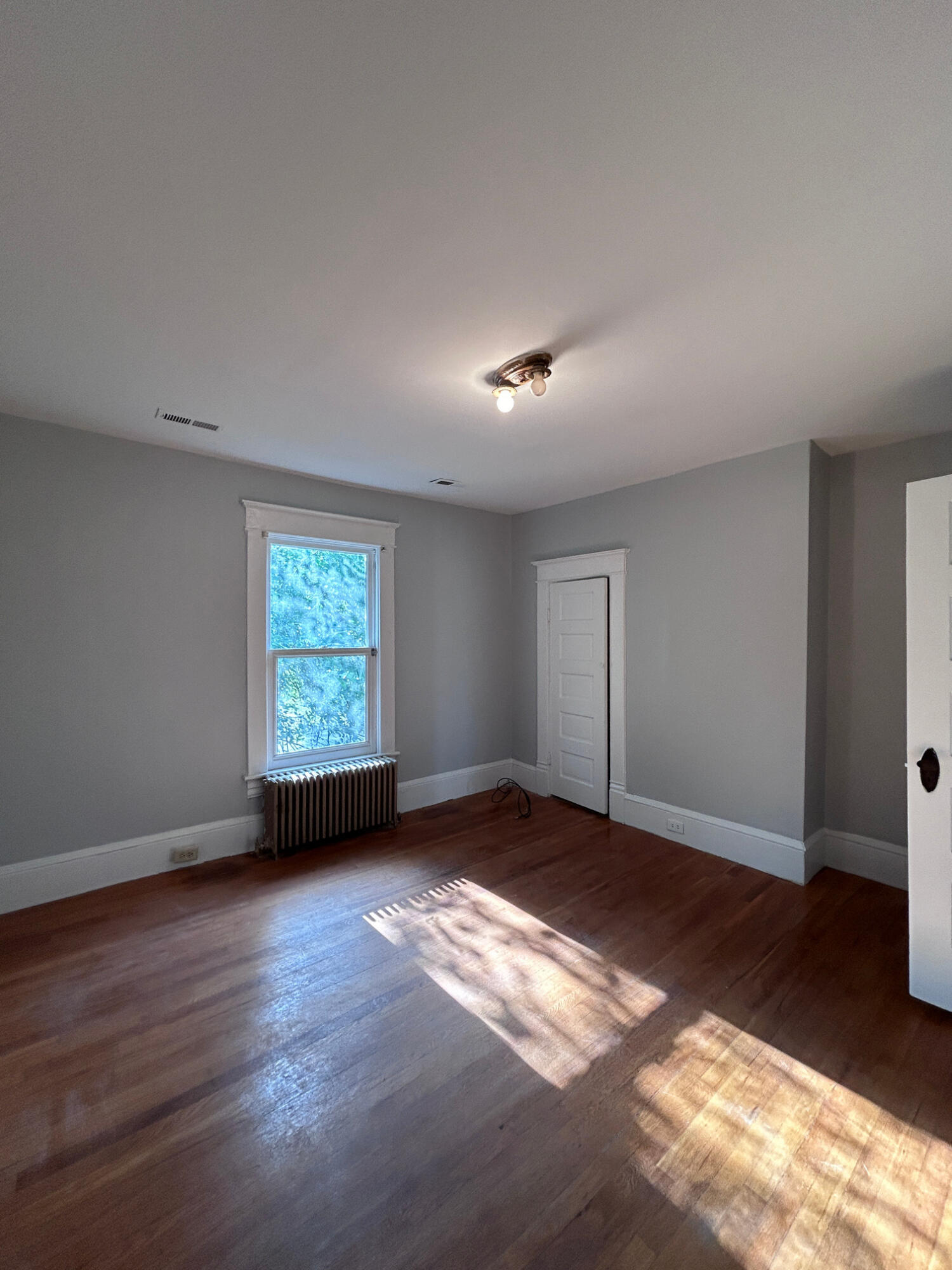 429 Albemarle Avenue Southwest, Unit UPPR Roanoke, VA 24016 - Photo 11 of 24 a view of an empty room with a window