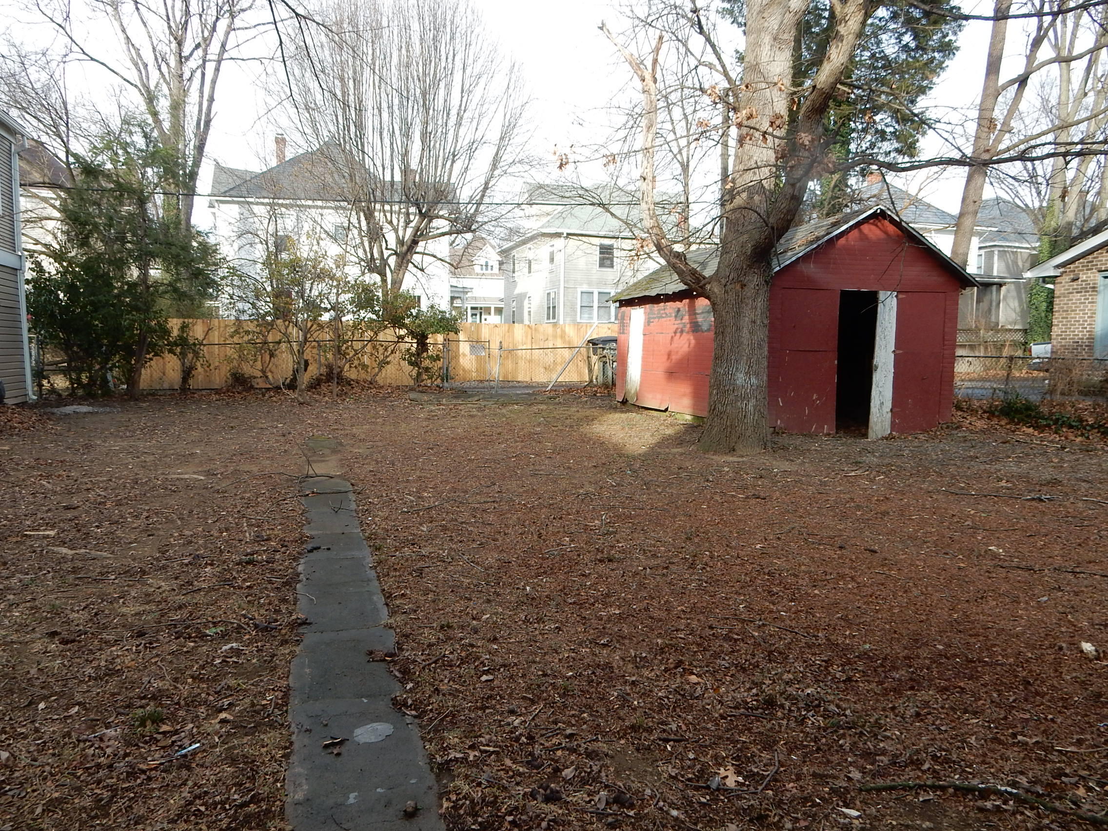 429 Albemarle Avenue Southwest, Unit UPPR Roanoke, VA 24016 - Photo 24 of 24 a front view of a house with a yard and garage