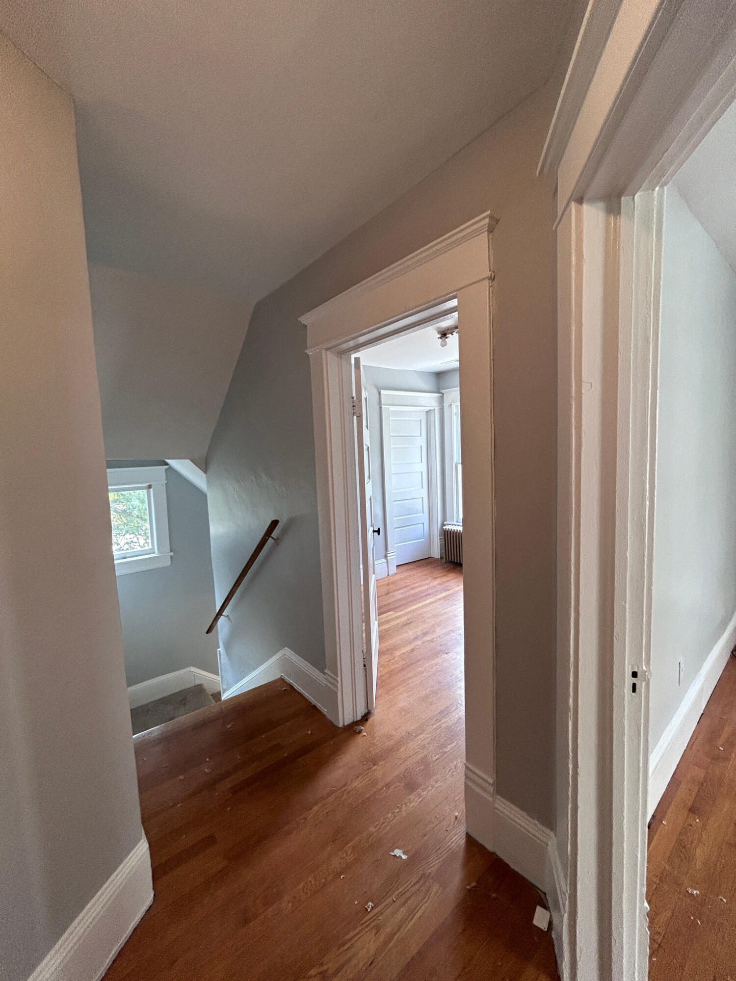 429 Albemarle Avenue Southwest, Unit UPPR Roanoke, VA 24016 - Photo 5 of 24 a view of hallway with stairs and wooden floor