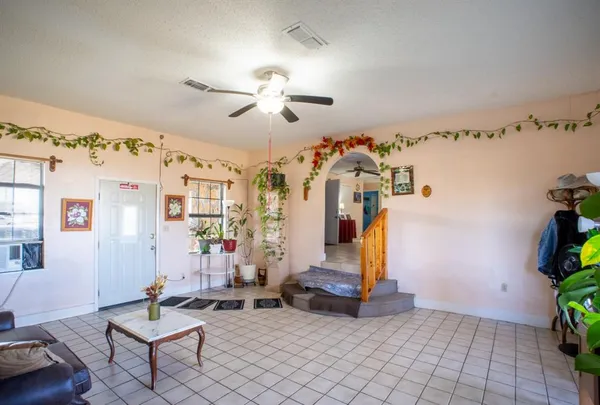 a living room with patio furniture