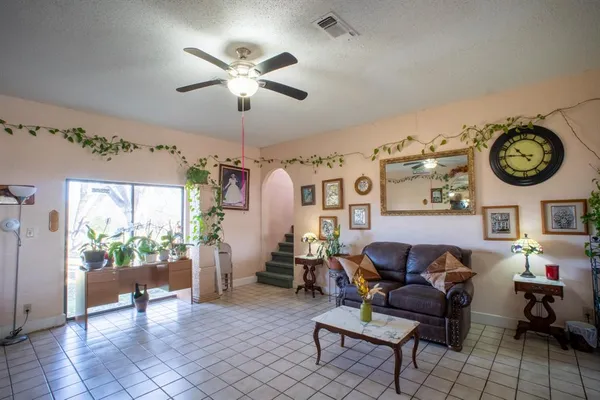 a living room with furniture and a clock