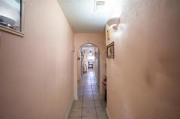 a view of a hallway view with staircase