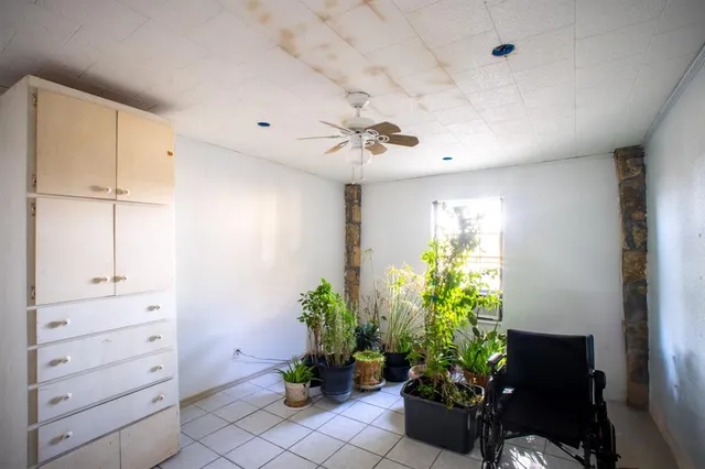 a view of a entryway with furniture and a potted plant