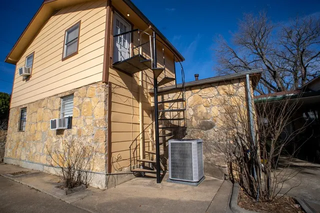 a view of a house with a tree