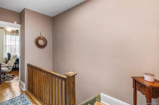 a view of a livingroom with furniture and hardwood floor