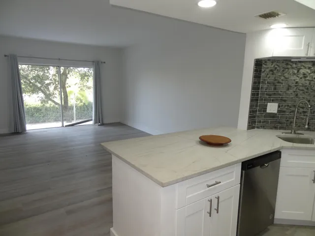 a kitchen with a sink and a window