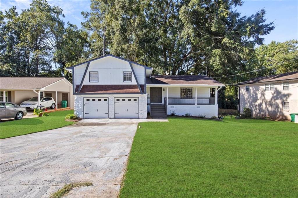 4023 Snapfinger Way Decatur, GA 30035 - Photo 1 of 1 a front view of a house with a yard and garage