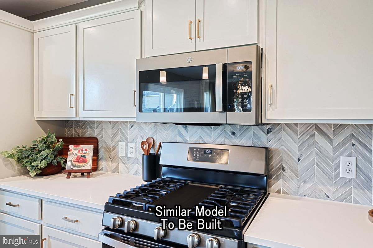 116 Redbud Road Bellefonte, PA 16823 - Photo 7 of 19 a kitchen with stainless steel appliances granite countertop a stove a microwave and cabinets