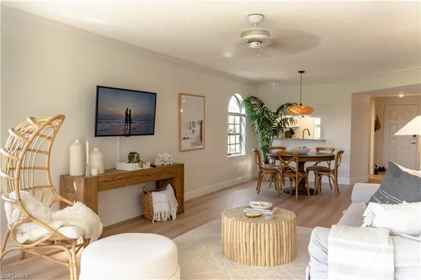 a balcony with furniture and wooden floor