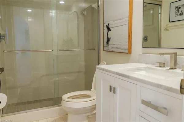 a view of a storage and utility room with washer and dryer