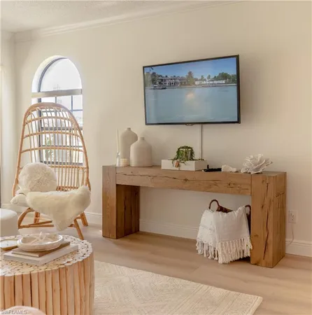 a living room with furniture and a mirror