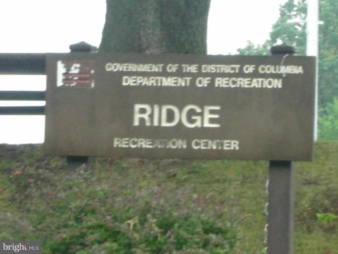 4732 Benning Road Southeast, Unit 102 Washington, DC 20019 - Photo 28 of 28 a sign broad on the side of a building