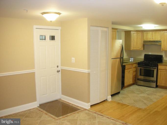4732 Benning Road Southeast, Unit 102 Washington, DC 20019 - Photo 4 of 28 a view of a kitchen with a sink