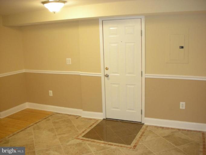 4732 Benning Road Southeast, Unit 102 Washington, DC 20019 - Photo 6 of 28 a view of an empty room