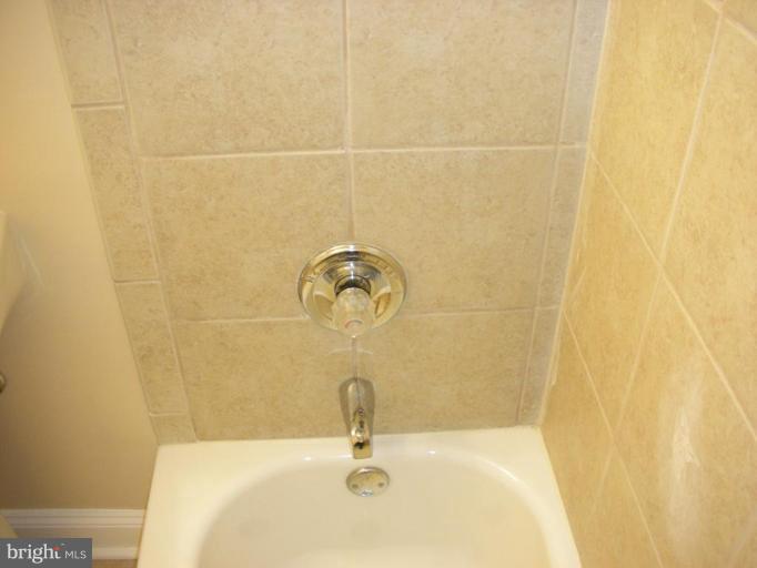 4732 Benning Road Southeast, Unit 102 Washington, DC 20019 - Photo 8 of 28 a bathroom with a sink