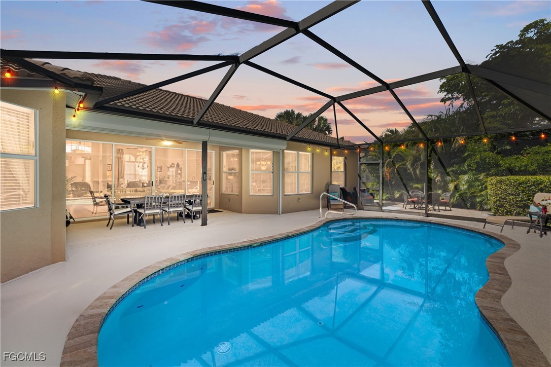 a view of swimming pool with outdoor seating