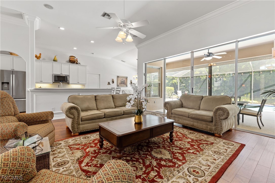15035 Balmoral Loop Fort Myers, FL 33919 - Photo 11 of 39 a living room with furniture and a large window