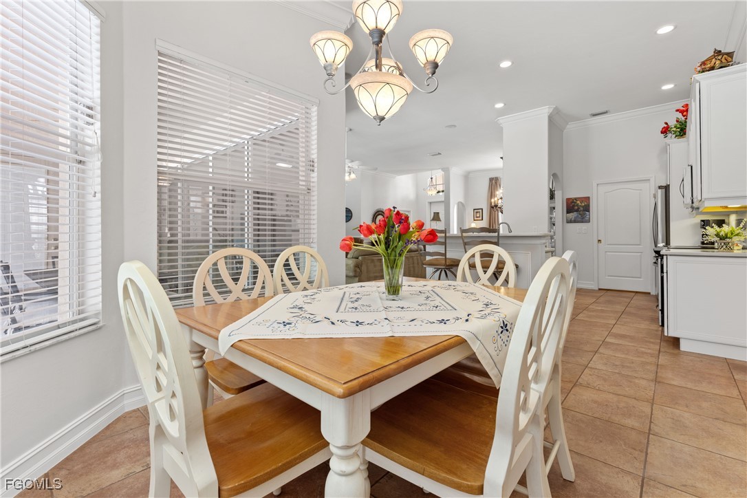 15035 Balmoral Loop Fort Myers, FL 33919 - Photo 15 of 39 a view of a dining room with furniture window and outside view