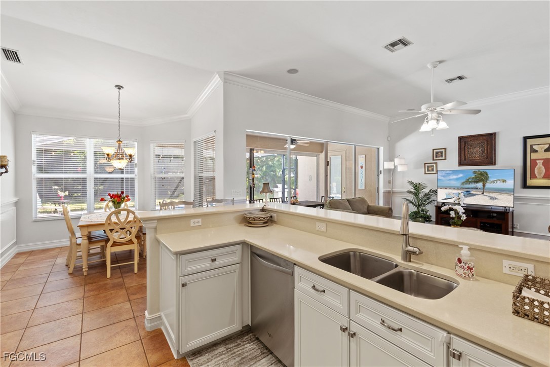 15035 Balmoral Loop Fort Myers, FL 33919 - Photo 21 of 39 a kitchen that has a sink and cabinets