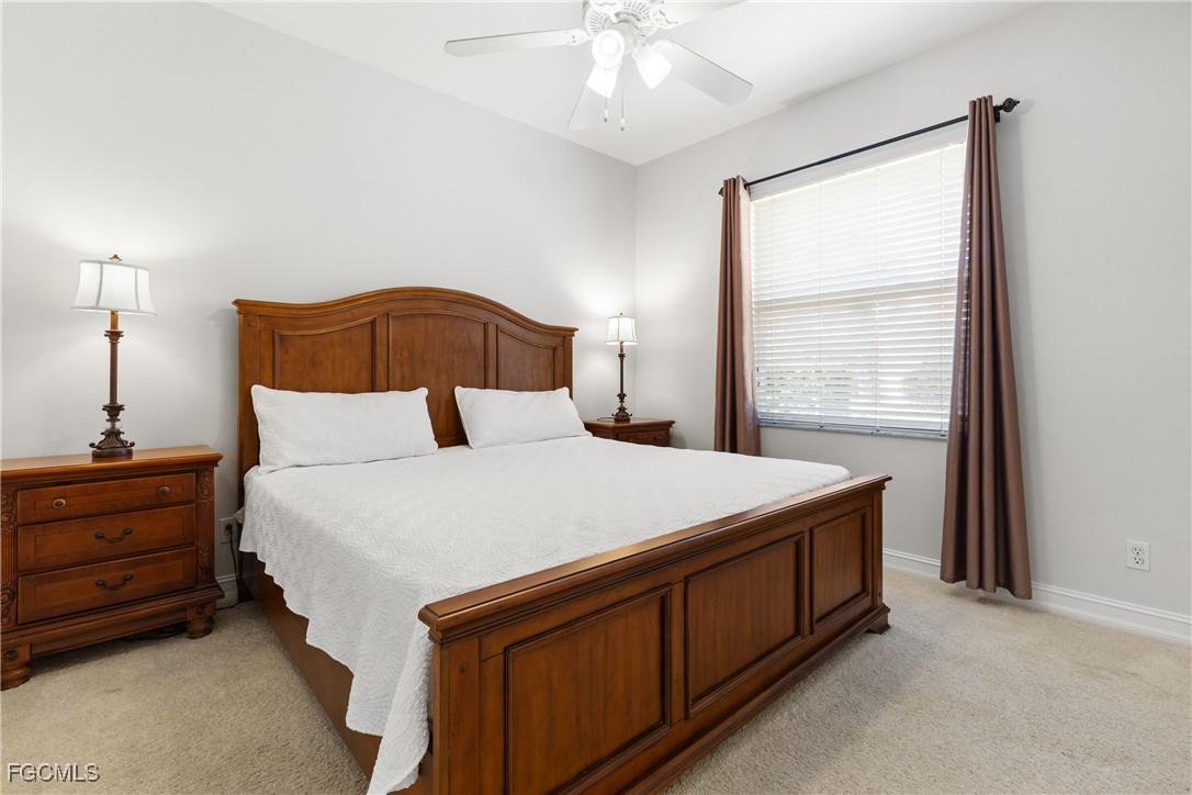 15035 Balmoral Loop Fort Myers, FL 33919 - Photo 22 of 39 a bedroom with a bed and a window