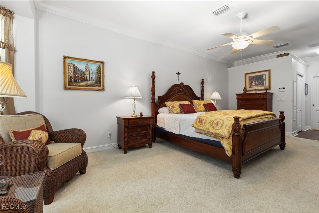 15035 Balmoral Loop Fort Myers, FL 33919 - Photo 28 of 39 a bedroom with bed couch and window