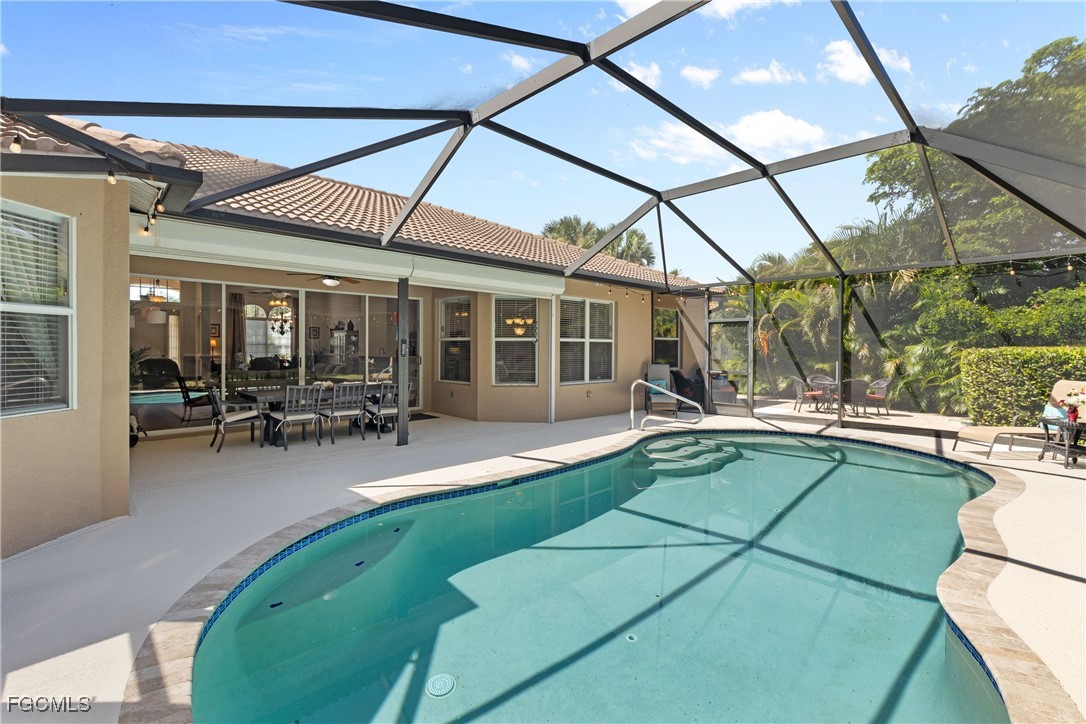 15035 Balmoral Loop Fort Myers, FL 33919 - Photo 35 of 39 a view of a swimming pool with outdoor seating