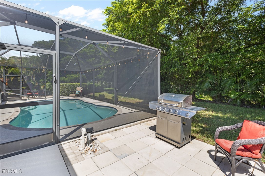 15035 Balmoral Loop Fort Myers, FL 33919 - Photo 38 of 39 a view of a backyard with sitting area and furniture