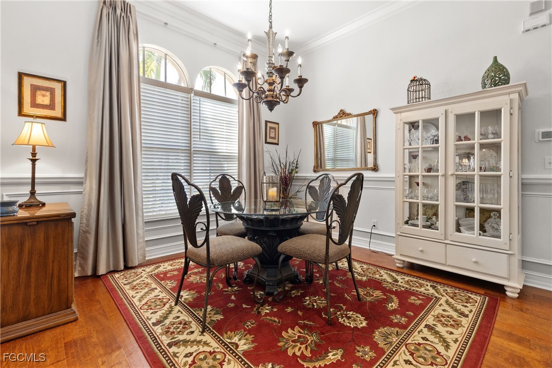 15035 Balmoral Loop Fort Myers, FL 33919 - Photo 9 of 39 a view of a dining room with furniture window and wooden floor