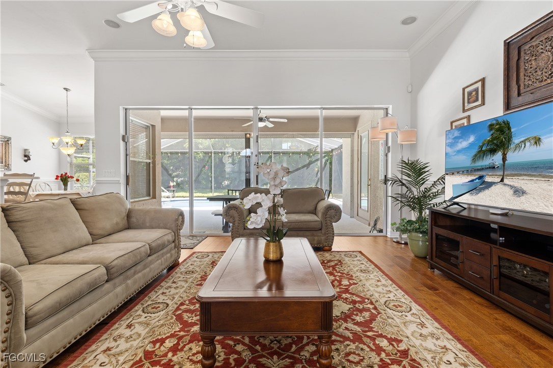 15035 Balmoral Loop Fort Myers, FL 33919 - Photo 10 of 39 a living room with furniture and a fireplace