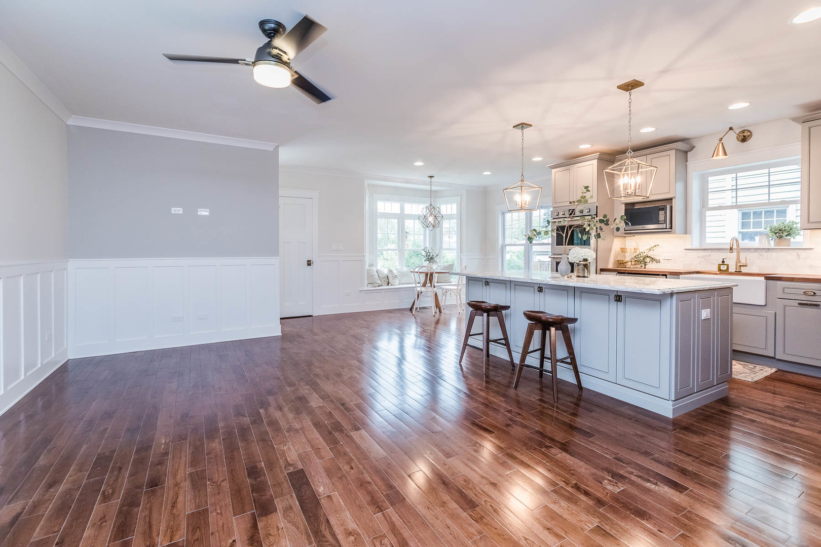 271 Lawton Road Riverside, IL 60546 - Photo 8 of 29 a kitchen with stainless steel appliances granite countertop wooden floors and view living room