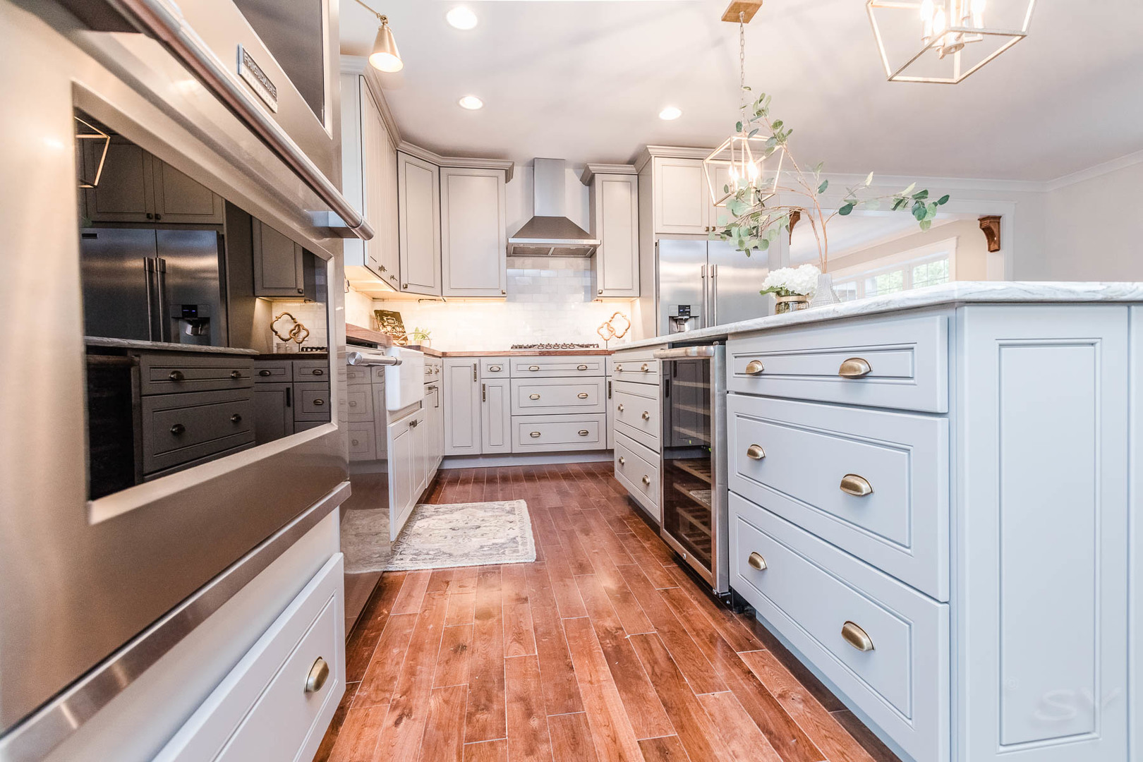 271 Lawton Road Riverside, IL 60546 - Photo 10 of 29 a kitchen with white cabinets and stainless steel appliances