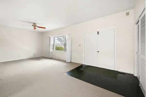 an empty room with windows