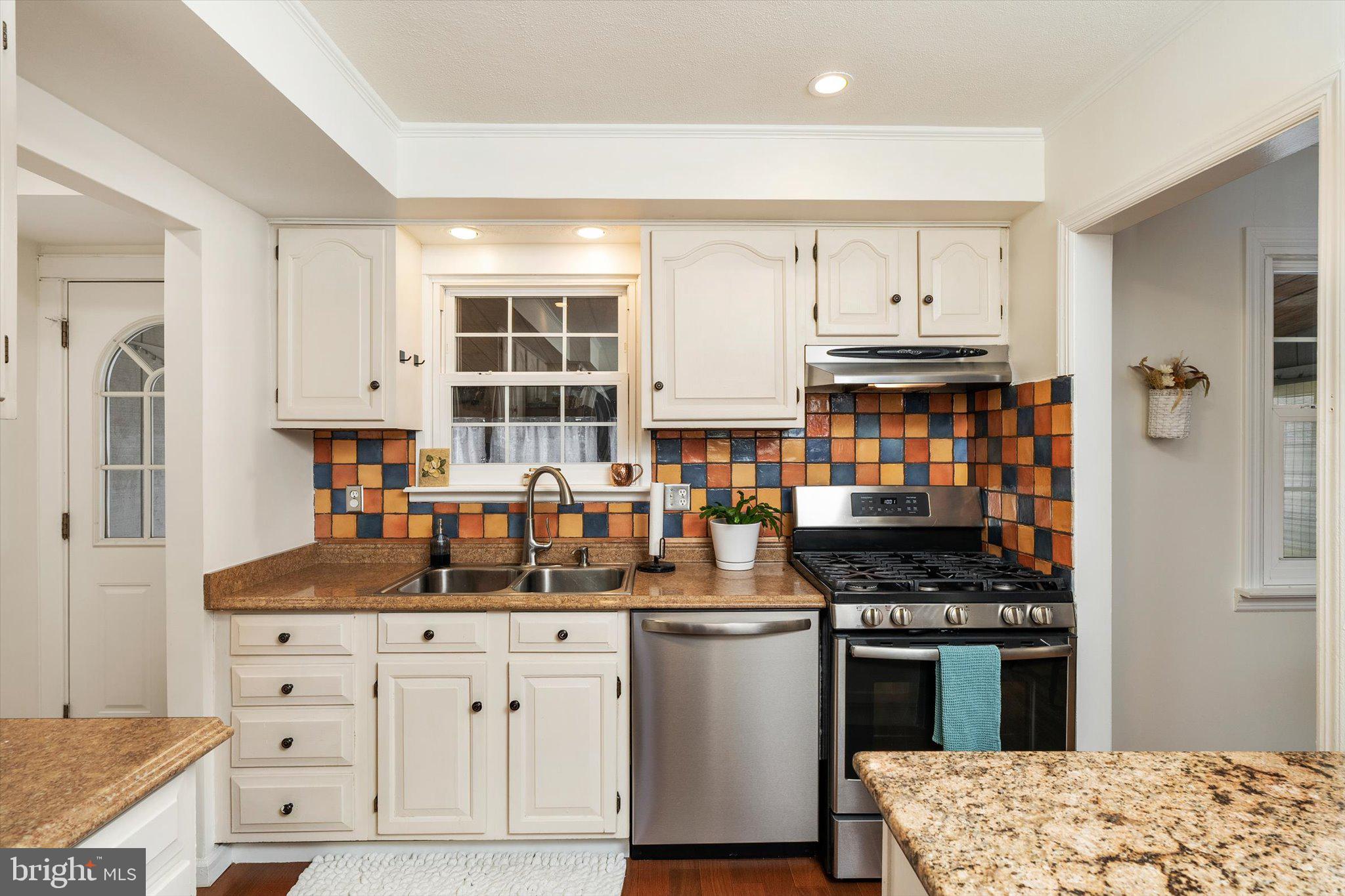 4 Imperial Drive Hamilton, NJ 08690 - Photo 14 of 36 a kitchen with stainless steel appliances kitchen island granite countertop a stove and a sink