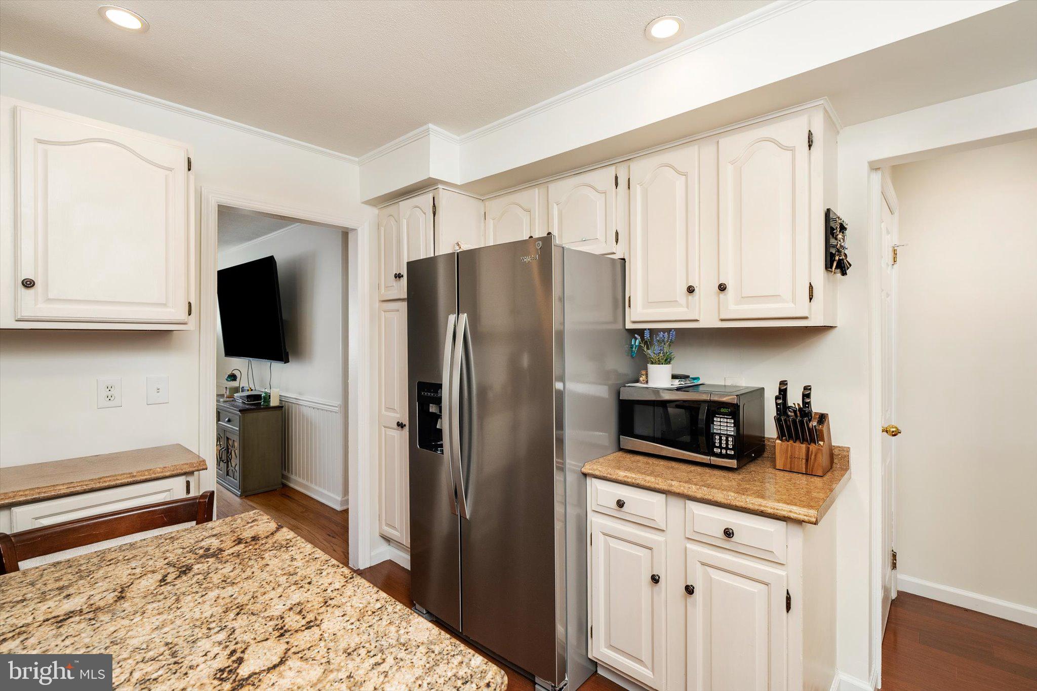 4 Imperial Drive Hamilton, NJ 08690 - Photo 15 of 36 a kitchen with stainless steel appliances granite countertop a refrigerator stove and white cabinets