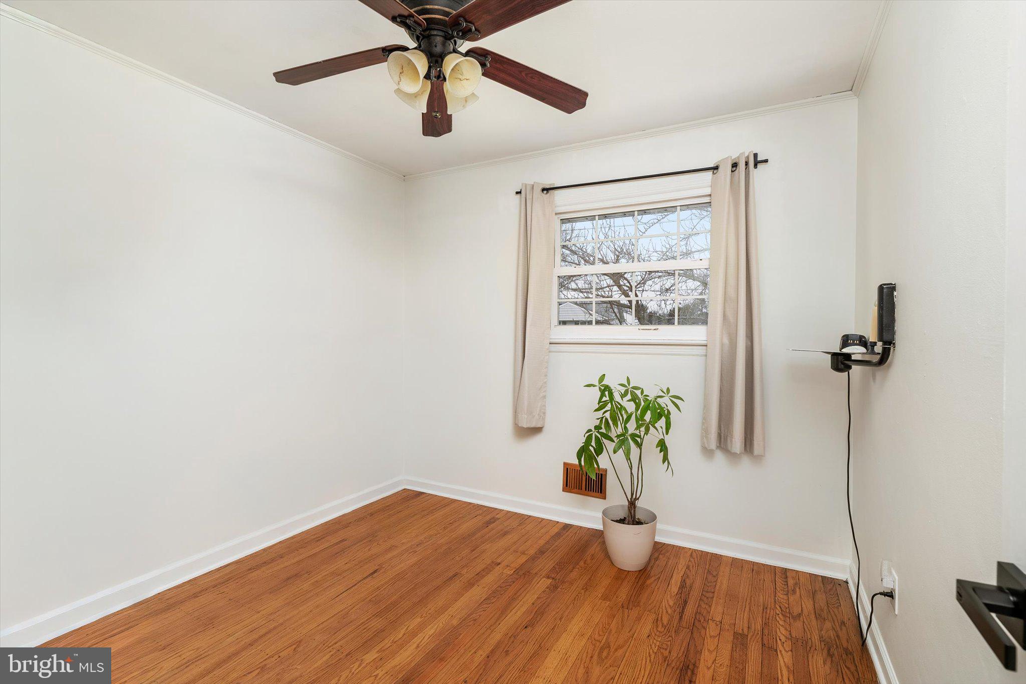 4 Imperial Drive Hamilton, NJ 08690 - Photo 23 of 36 wooden floor in an empty room with a window