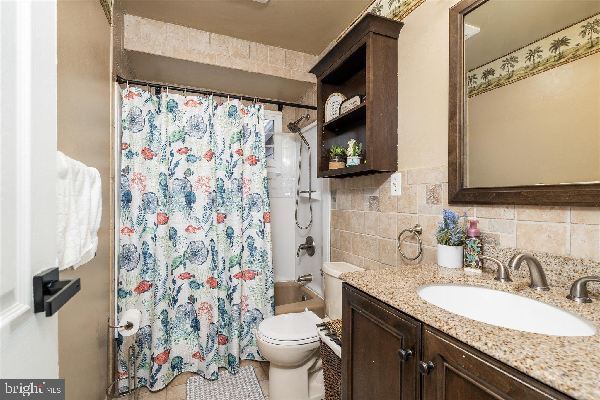 4 Imperial Drive Hamilton, NJ 08690 - Photo 24 of 36 a bathroom with a granite countertop sink and a toilet