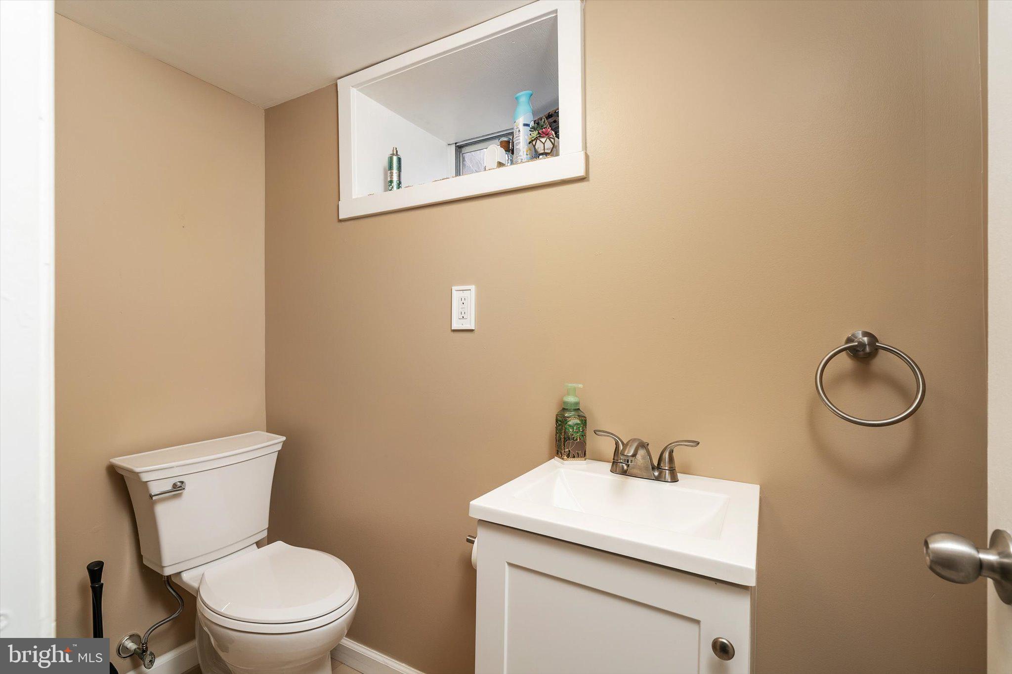 4 Imperial Drive Hamilton, NJ 08690 - Photo 27 of 36 a bathroom with a toilet a sink and mirror