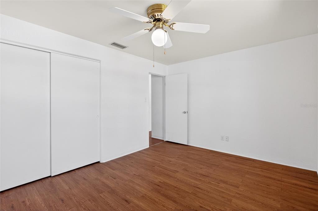 47 Carol Road Ormond Beach, FL 32176 - Photo 26 of 54 a view of an empty room with wooden floor