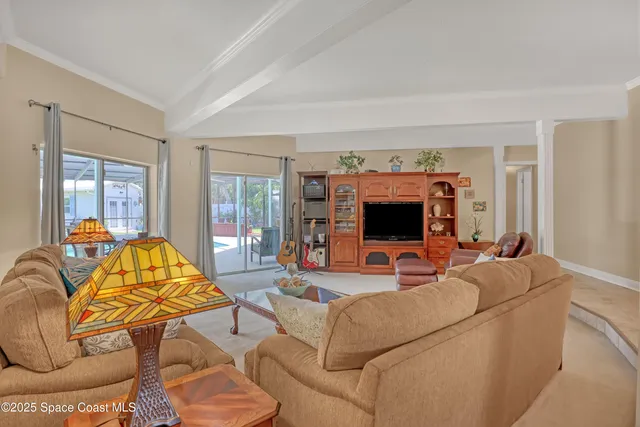 a kitchen with granite countertop a sink and a refrigerator