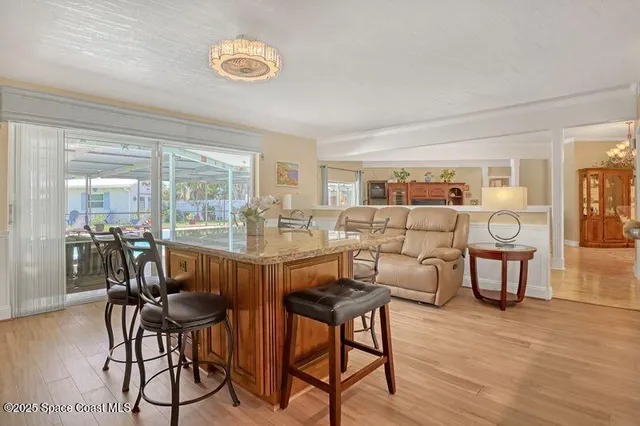 a kitchen with stainless steel appliances granite countertop a sink and cabinets